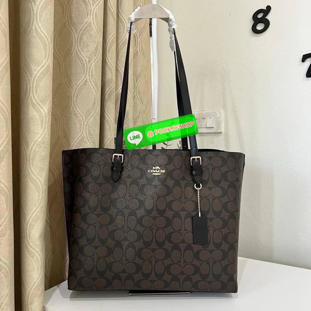Coach MOLLIE TOTE IN SIGNATURE CANVAS (COACH 1665) กระเป๋าหนังใบเคลือบซิกเนเจอร์และหนังเรียบ ภายในกระเป๋ามัลติฟังก์ชั่น ปิดด้วยซิป ซับในผ้า หูหิ้วพร้อมหูหิ้ว 10 1/4" ช่องเปิดด้านข้าง