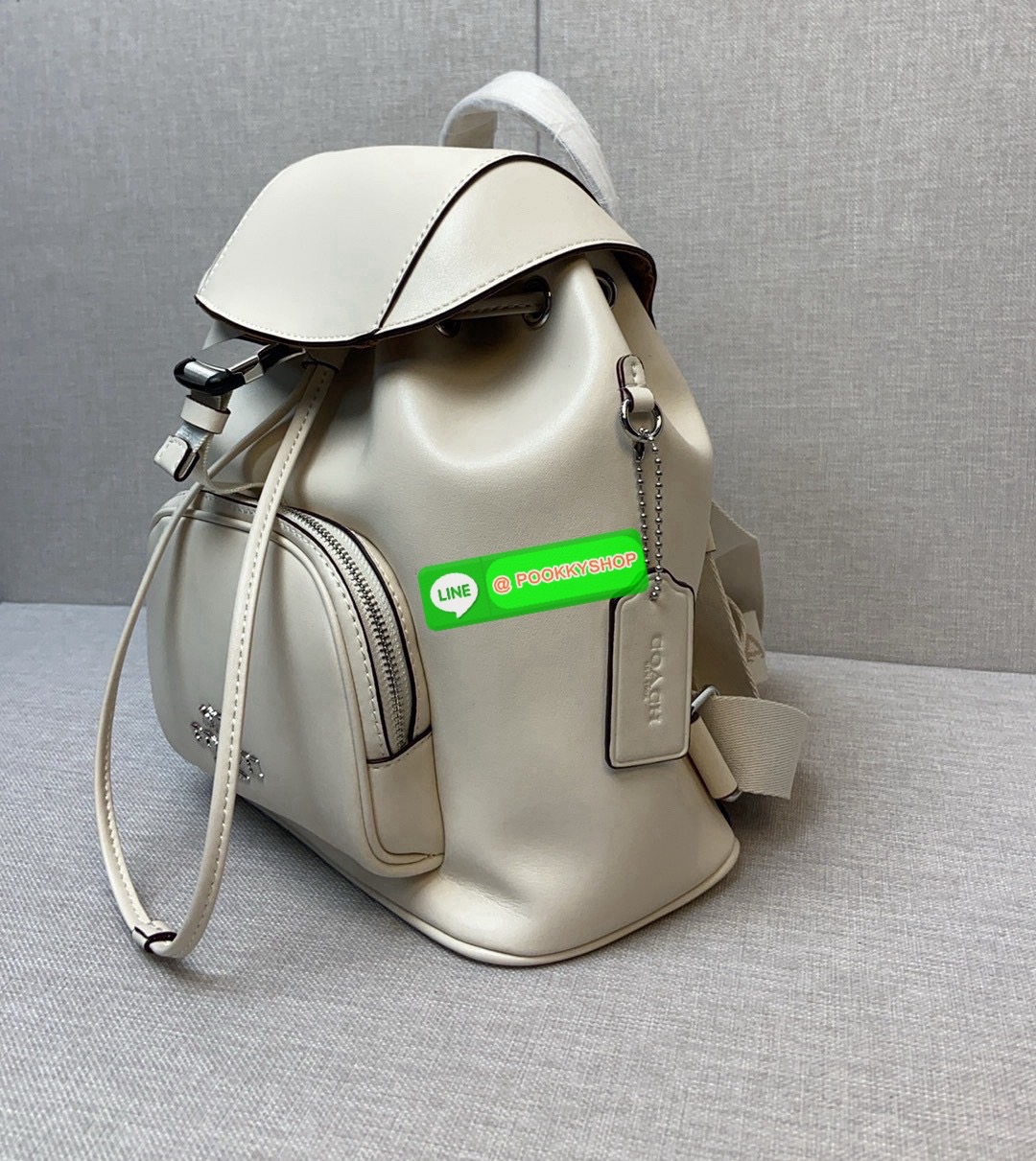 COACH PACE BACKPACK COACH CR100 | Refined calf leather | Inside zip and multifunction pockets | Drawstring and speedclip closures, fabric lining | Handle with 3" drop | Outside zip pocket | Outside zip access to interior |