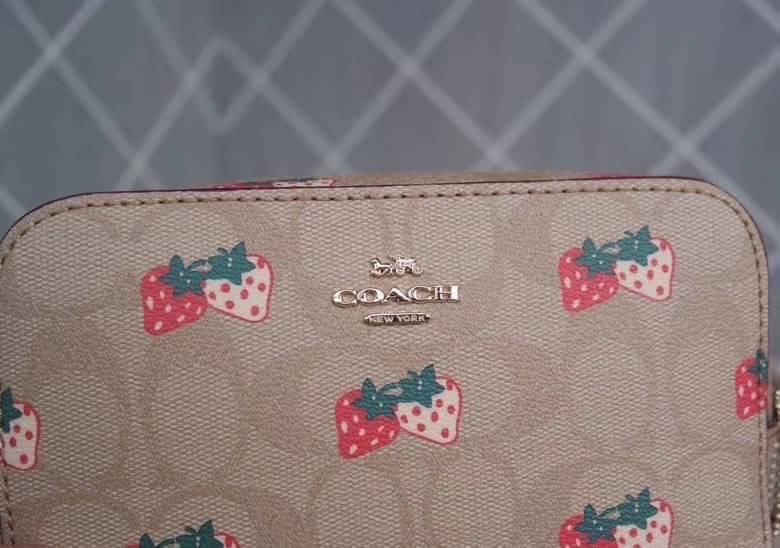Coach MINI CAMERA BAG IN SIGNATURE CANVAS WITH STRAWBERRY PRINT IM/KHAKI MULTI Signature coated canvas with smooth leather details| Two credit card slots| Inside multifunction pocket| Zip closure, fabric lining| Outside open pocket| Adjustable strap with