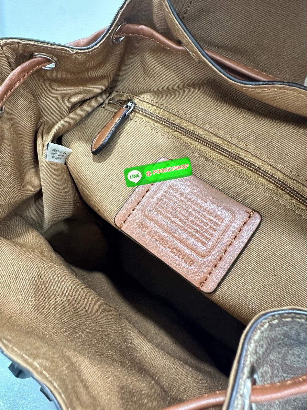 COACH PACE BACKPACK COACH CR100 | Refined calf leather | Inside zip and multifunction pockets | Drawstring and speedclip closures, fabric lining | Handle with 3" drop | Outside zip pocket | Outside zip access to interior |