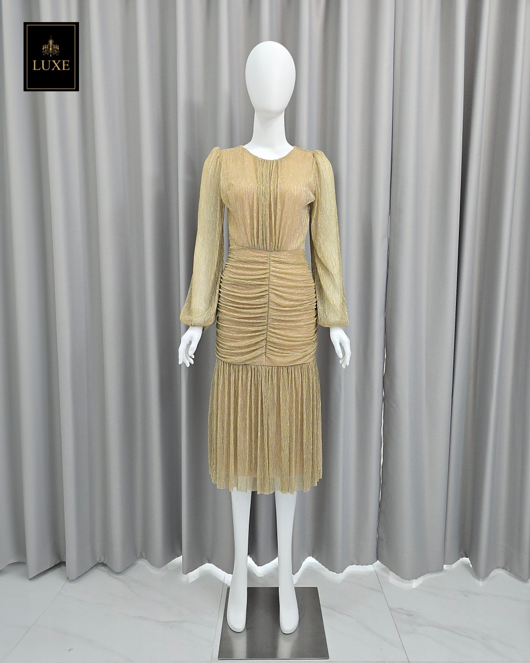 เดรสแฟชั่น เดรสเสื้อคอกลมแขนยาว กระโปรงทรงเข้ารูปจับเดรปตรงกลาง ต่อชายระบาย