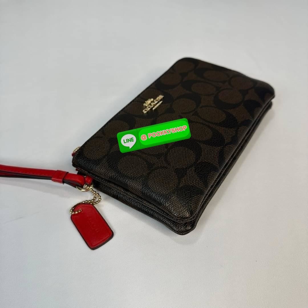กระเป๋าคล้องมือ COACH 87591 DOUBLE CORNER ZIP WRISTLET IN SIGNATURE CANVAS (COACH 87591 ） กระเป๋าคล้องมือ2เซิปใหญ่ ลายCหนังและ ด้านในเป็นผ้า แบ่งเป็นช่องเล็กๆใส่เหรียญใส่แบงค์ใส่บัตร แล้วแต่จะใส่มีหลายช่อง ใส่โทรศัพท์ได้ทุกรุ่นพร้อมสายคล้องมือ