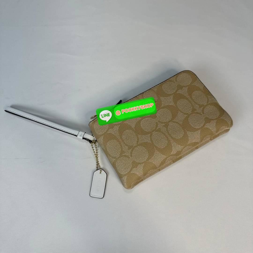 กระเป๋าคล้องมือ COACH 87591 DOUBLE CORNER ZIP WRISTLET IN SIGNATURE CANVAS (COACH 87591 ） กระเป๋าคล้องมือ2เซิปใหญ่ ลายCหนังและ ด้านในเป็นผ้า แบ่งเป็นช่องเล็กๆใส่เหรียญใส่แบงค์ใส่บัตร แล้วแต่จะใส่มีหลายช่อง ใส่โทรศัพท์ได้ทุกรุ่นพร้อมสายคล้องมือ