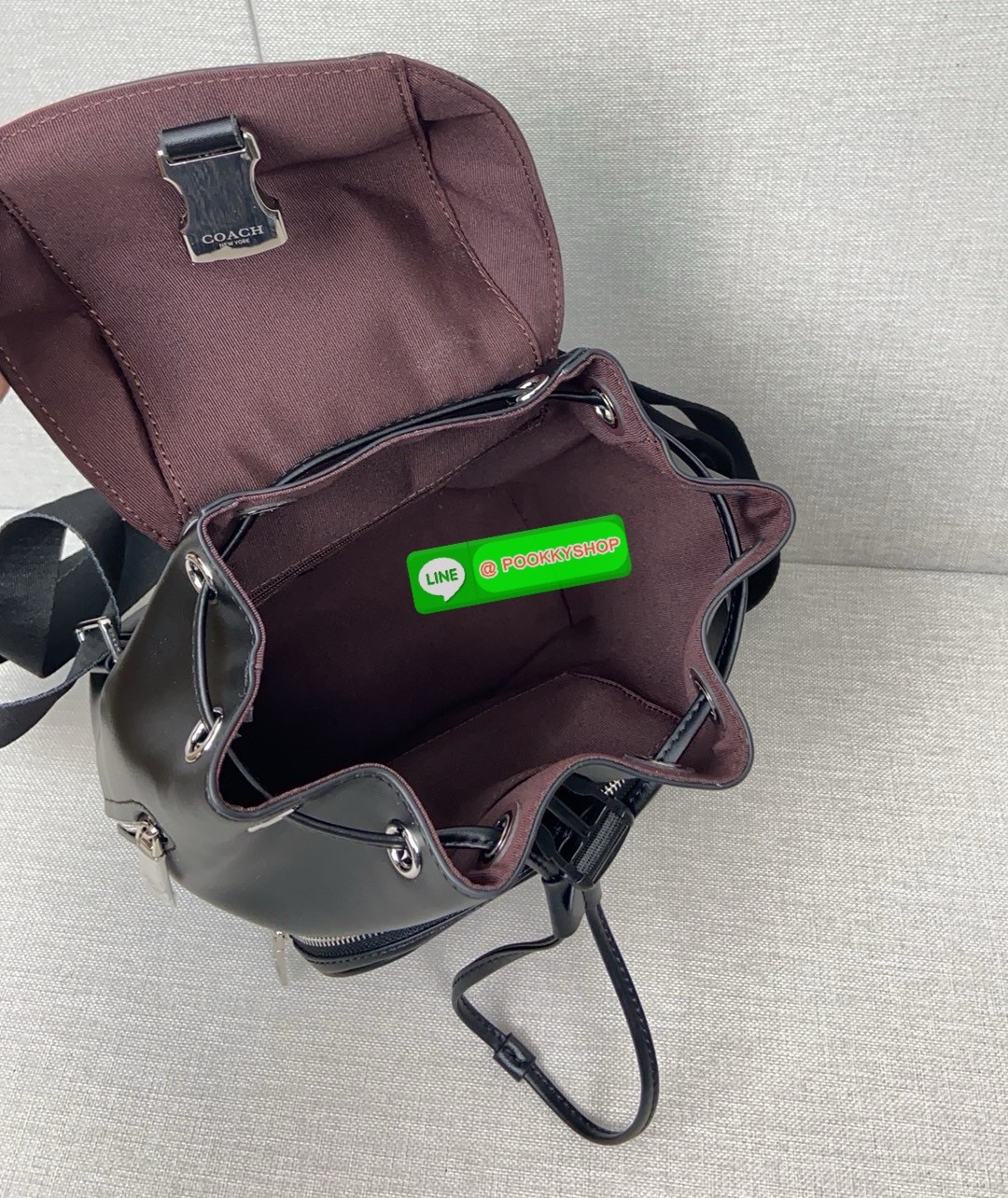 COACH PACE BACKPACK COACH CR100 | Refined calf leather | Inside zip and multifunction pockets | Drawstring and speedclip closures, fabric lining | Handle with 3" drop | Outside zip pocket | Outside zip access to interior |