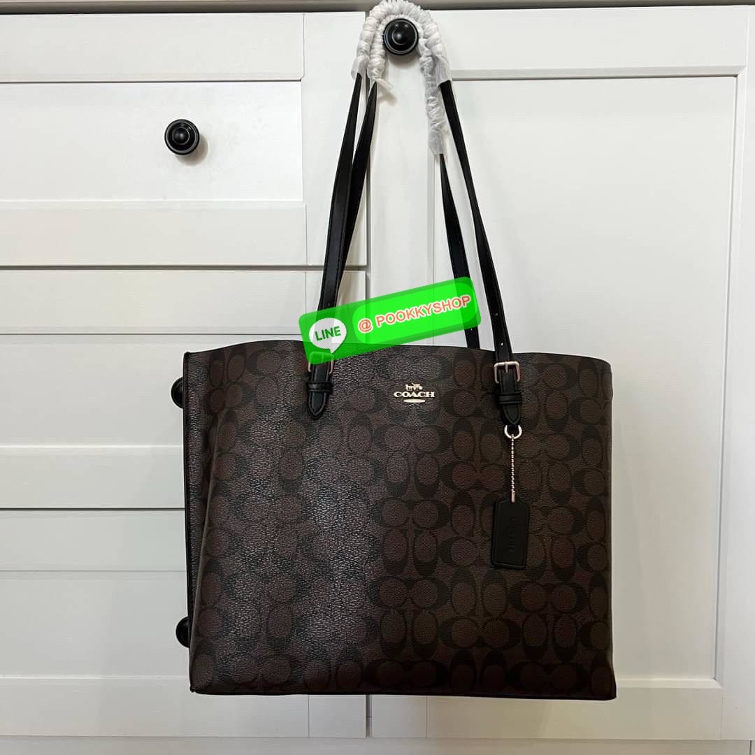 Coach MOLLIE TOTE IN SIGNATURE CANVAS (COACH 1665) กระเป๋าหนังใบเคลือบซิกเนเจอร์และหนังเรียบ ภายในกระเป๋ามัลติฟังก์ชั่น ปิดด้วยซิป ซับในผ้า หูหิ้วพร้อมหูหิ้ว 10 1/4" ช่องเปิดด้านข้าง