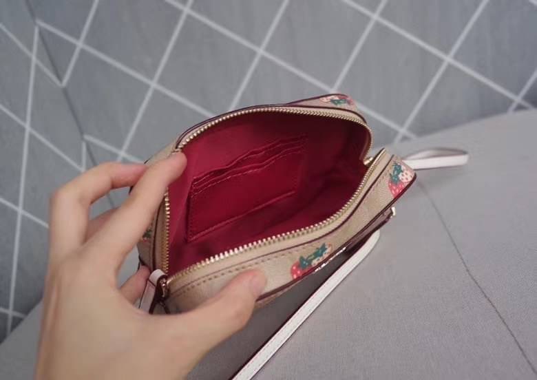 Coach MINI CAMERA BAG IN SIGNATURE CANVAS WITH STRAWBERRY PRINT IM/KHAKI MULTI Signature coated canvas with smooth leather details| Two credit card slots| Inside multifunction pocket| Zip closure, fabric lining| Outside open pocket| Adjustable strap with
