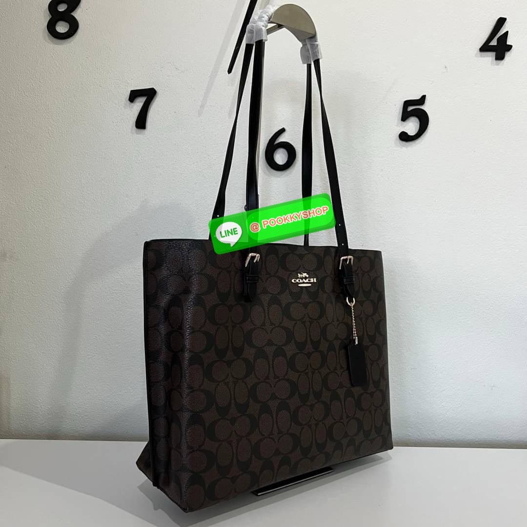 Coach MOLLIE TOTE IN SIGNATURE CANVAS (COACH 1665) กระเป๋าหนังใบเคลือบซิกเนเจอร์และหนังเรียบ ภายในกระเป๋ามัลติฟังก์ชั่น ปิดด้วยซิป ซับในผ้า หูหิ้วพร้อมหูหิ้ว 10 1/4" ช่องเปิดด้านข้าง