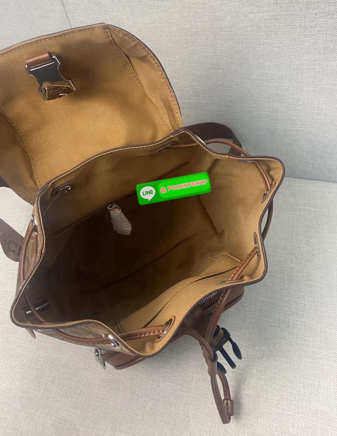 COACH PACE BACKPACK COACH CR100 | Refined calf leather | Inside zip and multifunction pockets | Drawstring and speedclip closures, fabric lining | Handle with 3" drop | Outside zip pocket | Outside zip access to interior |