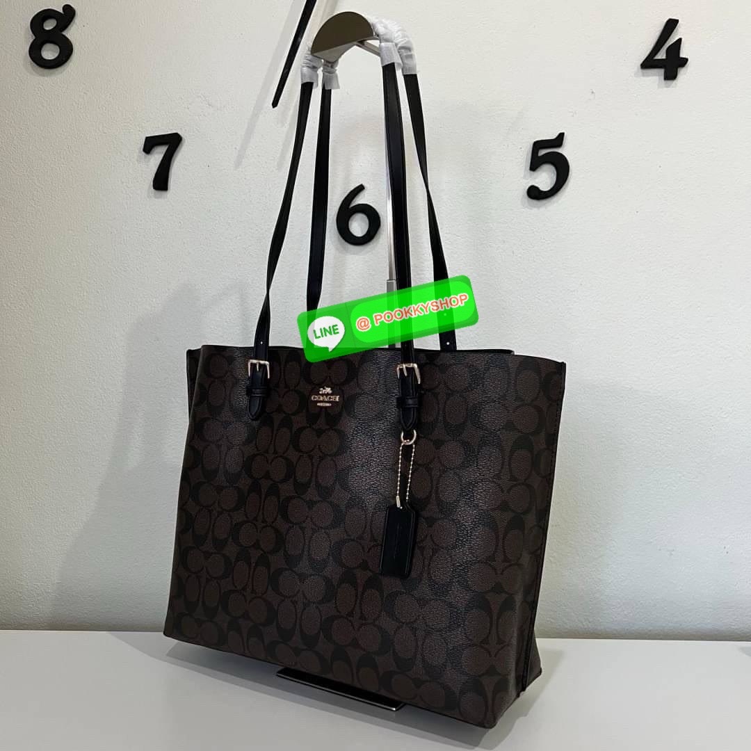 Coach MOLLIE TOTE IN SIGNATURE CANVAS (COACH 1665) กระเป๋าหนังใบเคลือบซิกเนเจอร์และหนังเรียบ ภายในกระเป๋ามัลติฟังก์ชั่น ปิดด้วยซิป ซับในผ้า หูหิ้วพร้อมหูหิ้ว 10 1/4" ช่องเปิดด้านข้าง