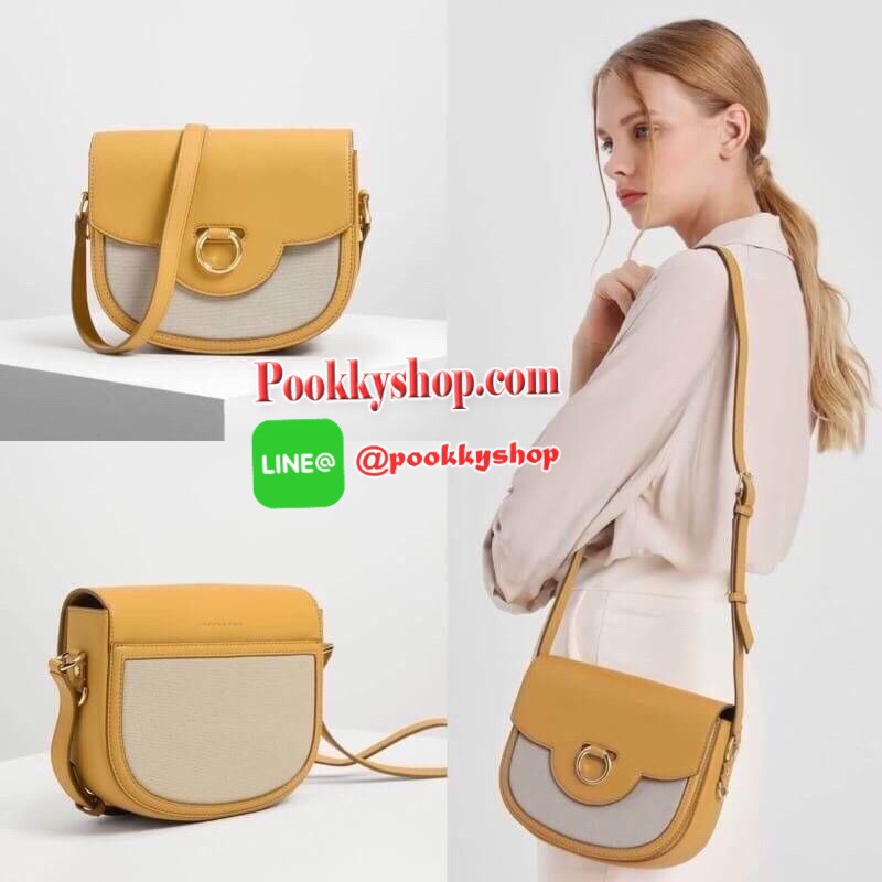 New arrival! 2019 CHARLES & KEITH RING BUCKLE SADDLE CROSSBODY BAG รุ่ยใหม่ชนช็อป!!! กระเป๋าสะพายข้าง/ครอสบอดี้อยู่ทรง วัสดุหนังตัดผ้าด้สนหน้า ด้านหลังมีช่องใส่ของได้เล็กน้อย เปิดปิดด้วยตัวล็อกดันขึ้น ด้านในเป็น 2 ช่องใหญ่ ใส่ของได้พอสมควรค่ะ เช่น iPhone