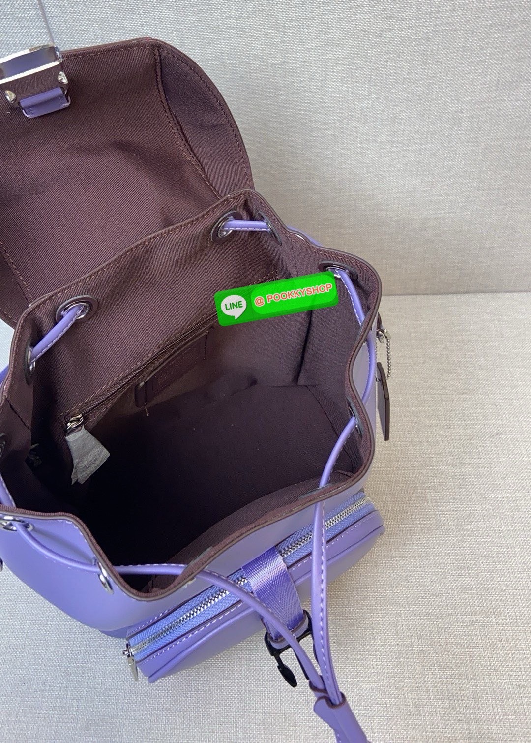 COACH PACE BACKPACK COACH CR100 | Refined calf leather | Inside zip and multifunction pockets | Drawstring and speedclip closures, fabric lining | Handle with 3" drop | Outside zip pocket | Outside zip access to interior |