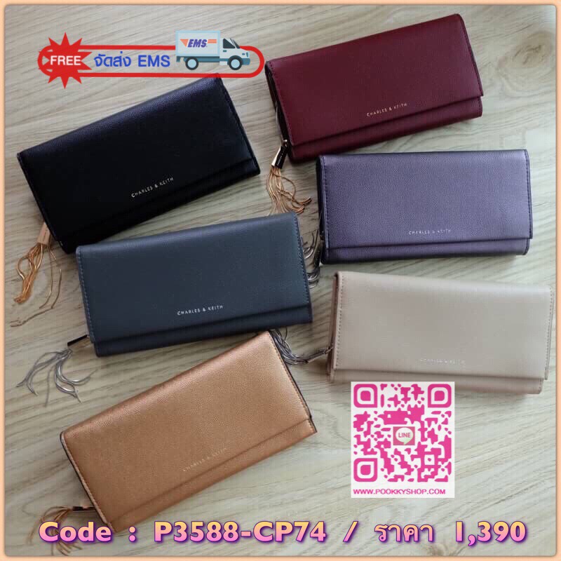 Charles & Keith Basic Long Wallet กระเป๋าสตางค์ใบยาว วัสดุหนังลายคาเวียร์ ตกแต่งด้วยพู่ เปิด – ปิดกระเป๋าด้วยเเม่เหล็กแบบซ่อน ภายในมีช่องใส่บัตร ช่องซิปใส่เหรียญ และช่องใส่ธนบัตร ใส่ iPhone Plus ได้ค่ะ ด้านหลังมีช่อง 1 ช่อง