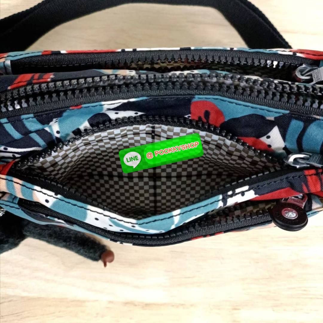 KIPLING Mini Crossbodybag กระเป๋าสะพายข้างขนาดกะทัดรัด ผลิตจากวัสดุ Nylon + ซับใน Polyester100% มีช่องใช้งานแยกย่อยมากถึง 4 ช่อง -ด้านหน้ามีช่องซิป 2 ช่อง -ช่องหลักโล่ง กว้าง จุของใช้ได้เยอะ -ด้านหลังมีช่องซิปอีก 1 ช่อง มาพร้อมพวงกุญเเจลิง สายสะพายยาวสมาร
