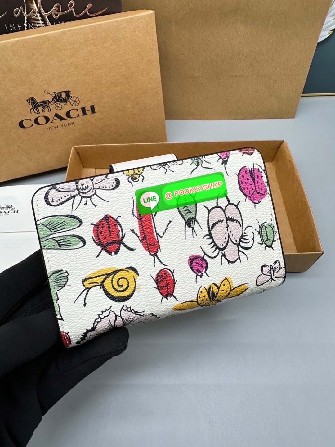 Coach Billfold Wallet With Floral Print Polished pebble leather Eight credit card slots Full-length bill compartment Snap closure Outside zip coin pocket