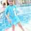 ฮ '' ( For Kids สำหรับเด็กอายุ 5-14 ปี ) Swimsuit for Girls ชุดว่ายน้ำ เด็กผู้หญิง Disney Frozen ชุดว่ายน้ำบอดี้สูท เสื้อแขนสั้น กระโปรงกางเกงขาสั้น สีฟ้า ลาย เจ้าหญิง อันนา เจ้าหญิงเอลซ่า มาพร้อมหมวกว่ายน้ำและถุงผ้า สุดน่ารัก ใส่สบาย